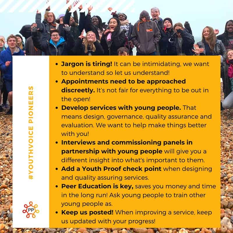 Group of young people at a youth event, smiling and engaging.
