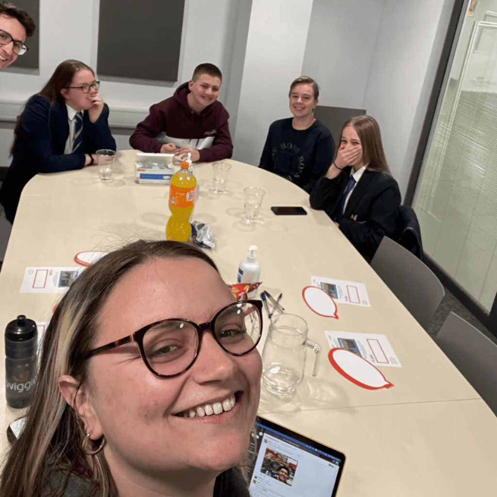 Participation People team meeting in a modern conference room with young professionals.
