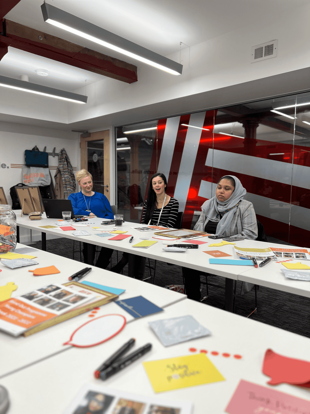 Diverse group of young people engaging in a workshop focused on career and personal growth.