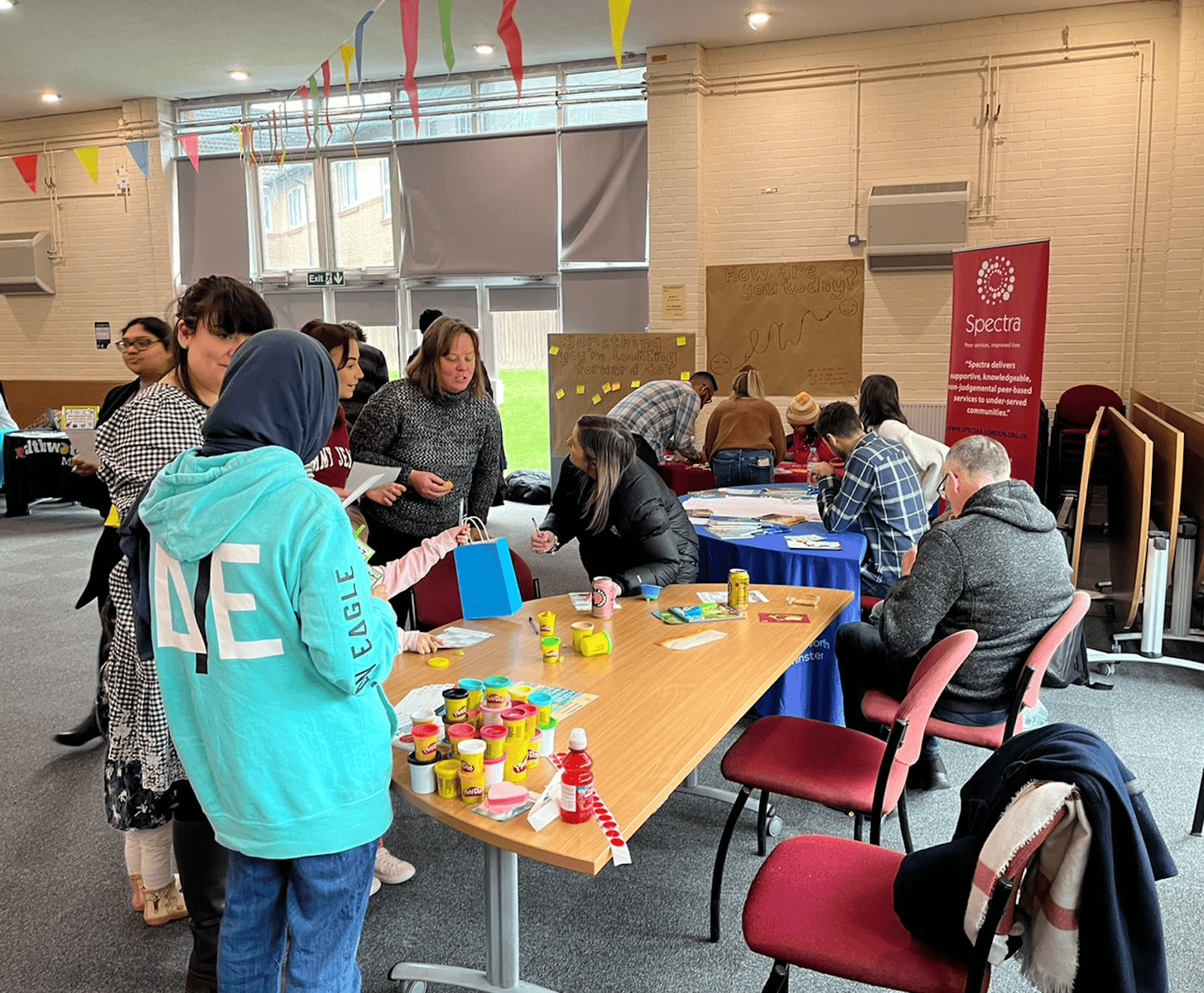 Young people and adults collaborating at a community workshop for youth health advocacy.