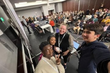 Young people collaborating with facilitators at a mental health platform workshop.