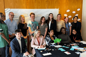 Diverse group of young professionals collaborating on connectivity solutions for business developmen.