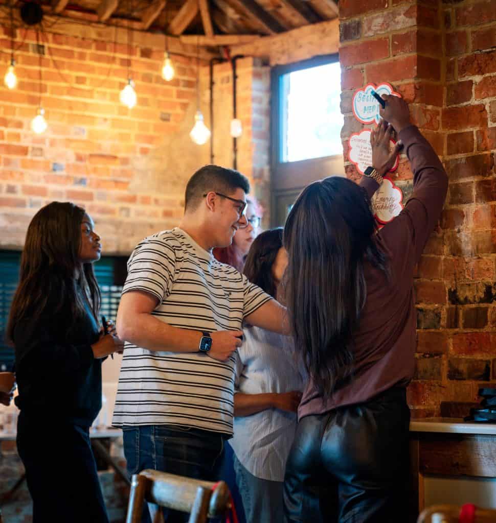 Young people collaborating at a youth hackathon event, fostering innovation and teamwork.