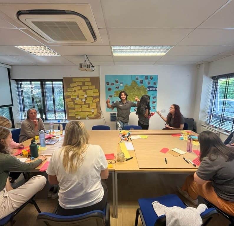 Engaged employees participating in a team-building activity during a recruitment and employee engage.