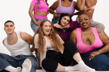 A photo of a group of young people raising breast cancer charity awareness