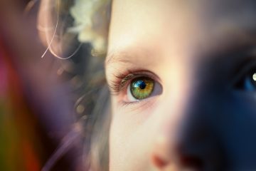 Close-up of a child's eye highlighting innocence and trust in public consultation processes.