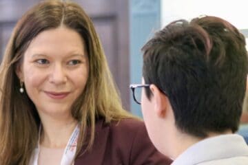a woman talking to a young man, a member of the future workforce